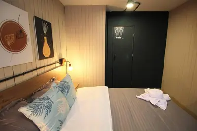 a hotel room with a bed with towels on it at Apartamento que permite mascota en Medellín ONE105 By Roots Rentals in Medellín