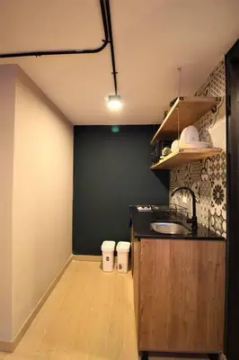 a kitchen with a sink and a counter top at Apartamento con cocina y baño privado - ONE106 By Roots Rentals in Medellín