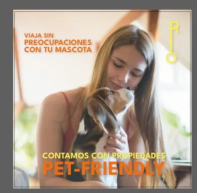 a woman holding a dog in her hands at Apartamento con cocina y baño privado - ONE106 By Roots Rentals in Medellín