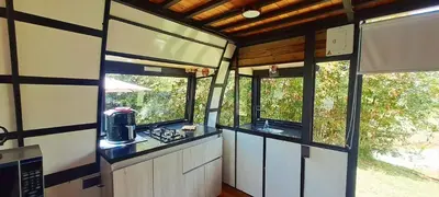 an interior view of an rv kitchen with windows at Chalet Petit Verdot in Santa Elena