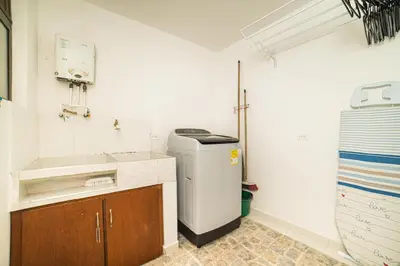 a small kitchen with a sink and a trash can at Alojamiento Acogedor con excelente ubicacion D in Medellín