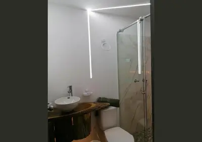 a bathroom with a sink and a toilet and a shower at Hotel Cabañas y Chalets lujosos Mágica Luna Manizales in Villamaría
