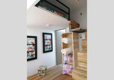 a staircase leading up to a room with white walls at Hotel Cabañas y Chalets lujosos Mágica Luna Manizales in Villamaría