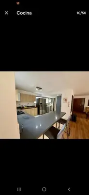 a view of a kitchen and a table in a room at Poblado la 10 in Medellín