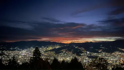 a view of a city lit up at night at Hilltop Enchanting Villa with Stunning Views & Jacuzzi in Medellín