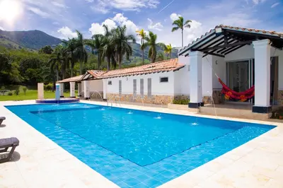 a swimming pool in front of a house at Espectacular Villa en Copacabana in Copacabana