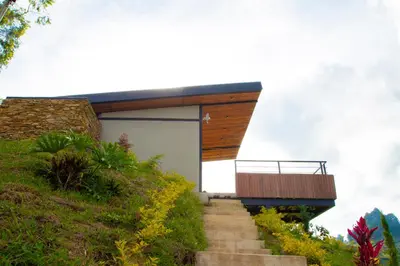 a house on top of a hill with stairs at Glamping en Guatape Wifi Jacuzzi in Guatapé