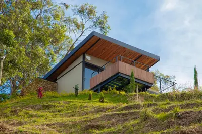 a house on top of a hill at Glamping en Guatape Wifi Jacuzzi in Guatapé