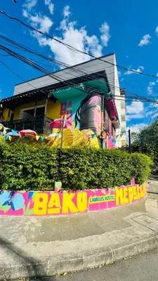 a building with a sign that says bar ki at Baku Laureles Hostel in Medellín