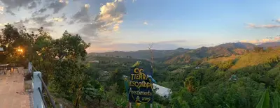 a sign for a mountain resort with mountains in the background at APARTAMENTO CAMPESTRE EN EJE CAFETERO in Manizales