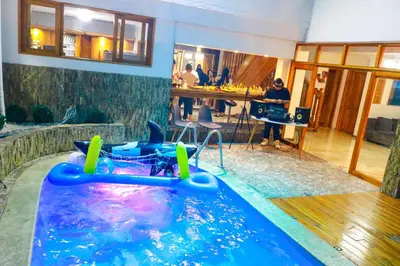 a pool in a room with a water slide at Económica casa con piscina privada en Medellín MLB by Lets Go in Medellín