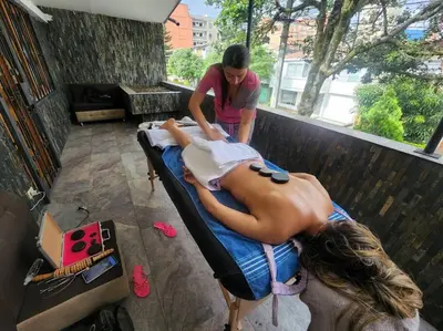 a woman getting a massage on a bed at Económica casa con piscina privada en Medellín MLB by Lets Go in Medellín