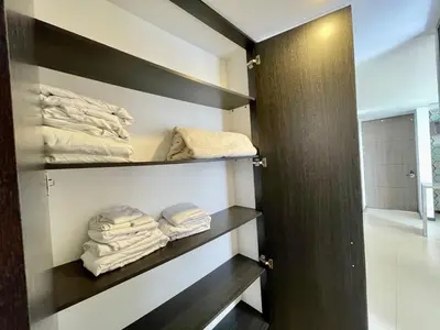 a room with a closet with folded towels at Space, best location & price! in Medellín