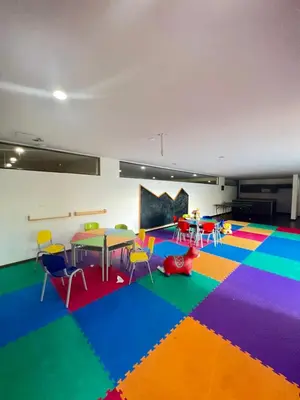 a room with a table and chairs and a colorful carpet at Space, best location & price! in Medellín