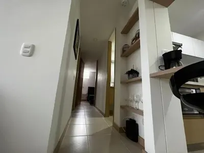 a hallway of a building with a long corridor at Hermoso apartamento la Francia 3 habitaciones in Manizales
