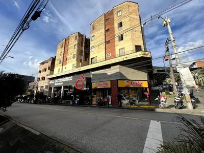 a building on the side of a city street at apartamento grande, hermoso, acogedor y privado in Medellín