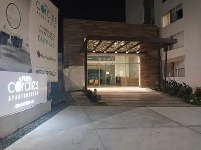 a entrance to a building with a sign in front of it at Confortable apartamento in Manizales