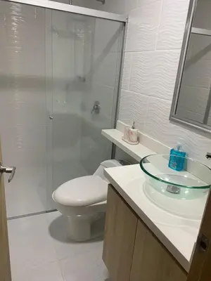 a bathroom with a toilet and a shower and a sink at Apartamento en laureles con excelente ubicación in Medellín
