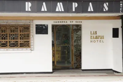 an entrance to a store with a glass door at Hotel Las Rampas in Medellín