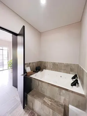 a large bath tub in a room with a large room at 1714 Hotel Boutique Guatapé in Guatapé