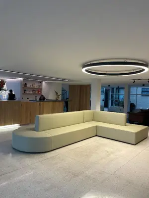 a living room with a white couch in a room at Hotel Santiago de Arma in Rionegro