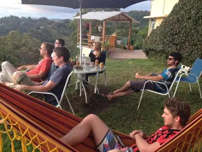 a group of people sitting in a hammock at Mirador Finca Morrogacho in Manizales