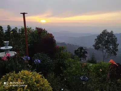 a view of the sun setting over the mountains at Mirador Finca Morrogacho in Manizales