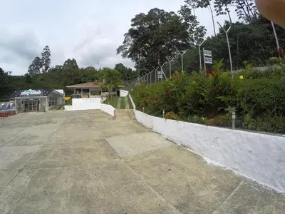 an empty parking lot next to a fence at Sky Club Eco Hotel in Belén de Umbría