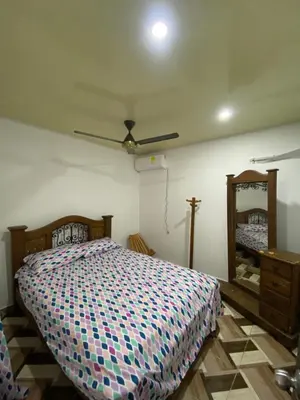 a bedroom with a bed and a ceiling fan at Apartamento bustos in Puerto Triunfo