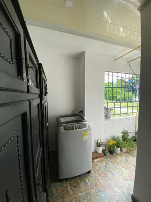 a trash can in a room with a window at Apartamento bustos in Puerto Triunfo