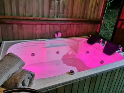 a hot pink bath tub with a towel in it at Sukha Glamping in Rionegro