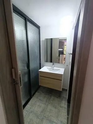 a bathroom with a white sink and a shower at Aparta Hotel LOFT Campestre Jacuzzi Poblado apt 107 in Medellín