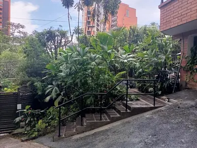 a set of stairs with trees and plants at Aparta Hotel LOFT Campestre Jacuzzi Poblado apt 107 in Medellín