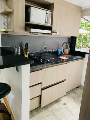 a kitchen with a sink and a microwave at Aparta Hotel LOFT Campestre Jacuzzi Poblado apt 107 in Medellín