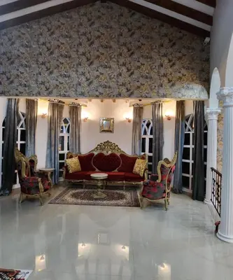 a living room with a red couch and chairs at Hotel Mansion Sant Serrant Medellín- Aeropuerto Rionegro in Marinilla