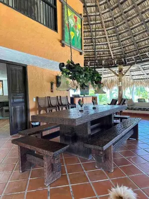 a large wooden table and benches in a building at increible casa de campo con piscina y jacuzzi! in Támesis