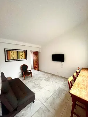 a living room with a couch and a table at La Posada de Miguel in Medellín