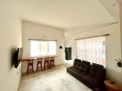 a living room with a couch and a table at La Posada de Miguel in Medellín