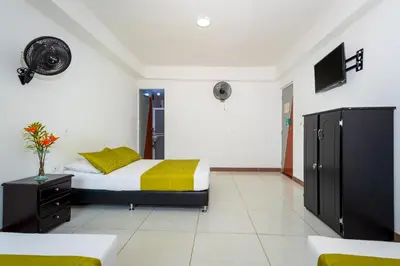 a bedroom with a bed and a tv in it at Ayenda 1234 Imperio 70 in Medellín