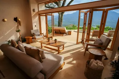 a living room with a couch and a table at Hotel Tahiti in Puente Iglesias