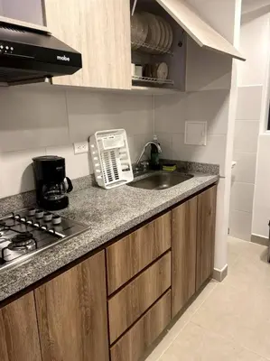 a kitchen with a sink and a counter top at Apartamento nuevo centro histórico! in Manizales