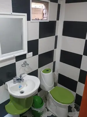 a bathroom with a sink and a toilet at Hotel flamingo real T in Mariquita