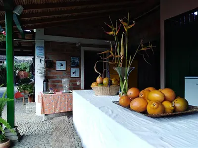a table with a bunch of fruit on it at Hotel Kantarrana Urbana Jardin in Jardin
