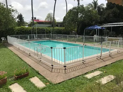 a swimming pool with a fence around it at CASAQUINTA PRIVADA MARIQUITA-TOLIMA in Mariquita