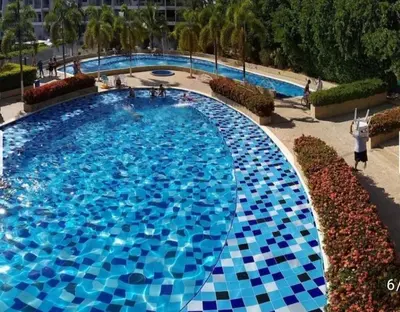 a large swimming pool with blue tiles on it at Apartamento 2 habitaciones aire acondicionado en Sopetran Unidad res Piscinas sol y descanso in Sopetran