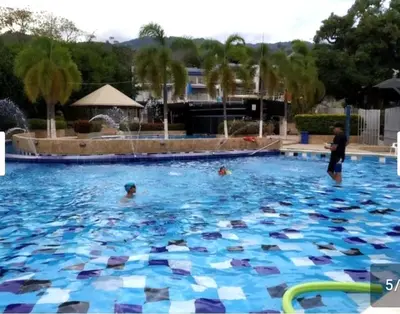 a group of people in a swimming pool at Apartamento 2 habitaciones aire acondicionado en Sopetran Unidad res Piscinas sol y descanso in Sopetran