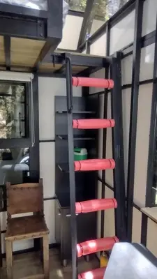 a ladder in an rv with red handles at Chalet Tanat in Santa Elena