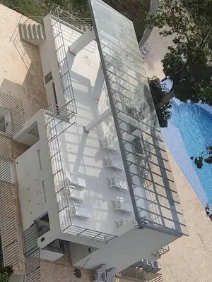 an external view of a building with a swimming pool at occidente colonial santa fe de Antioquia tipo resort Aparta sol tobogán kanaloa parque acuático in Santa Fe de Antioquia