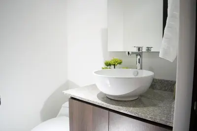 a bathroom with a white bowl sink on a counter at Super Apartment El Poblado Tesoro 2 rooms, 3 baths - 6 guests in Medellín