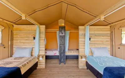 a bedroom with two beds in a house at Glamping Jardín in Jardin